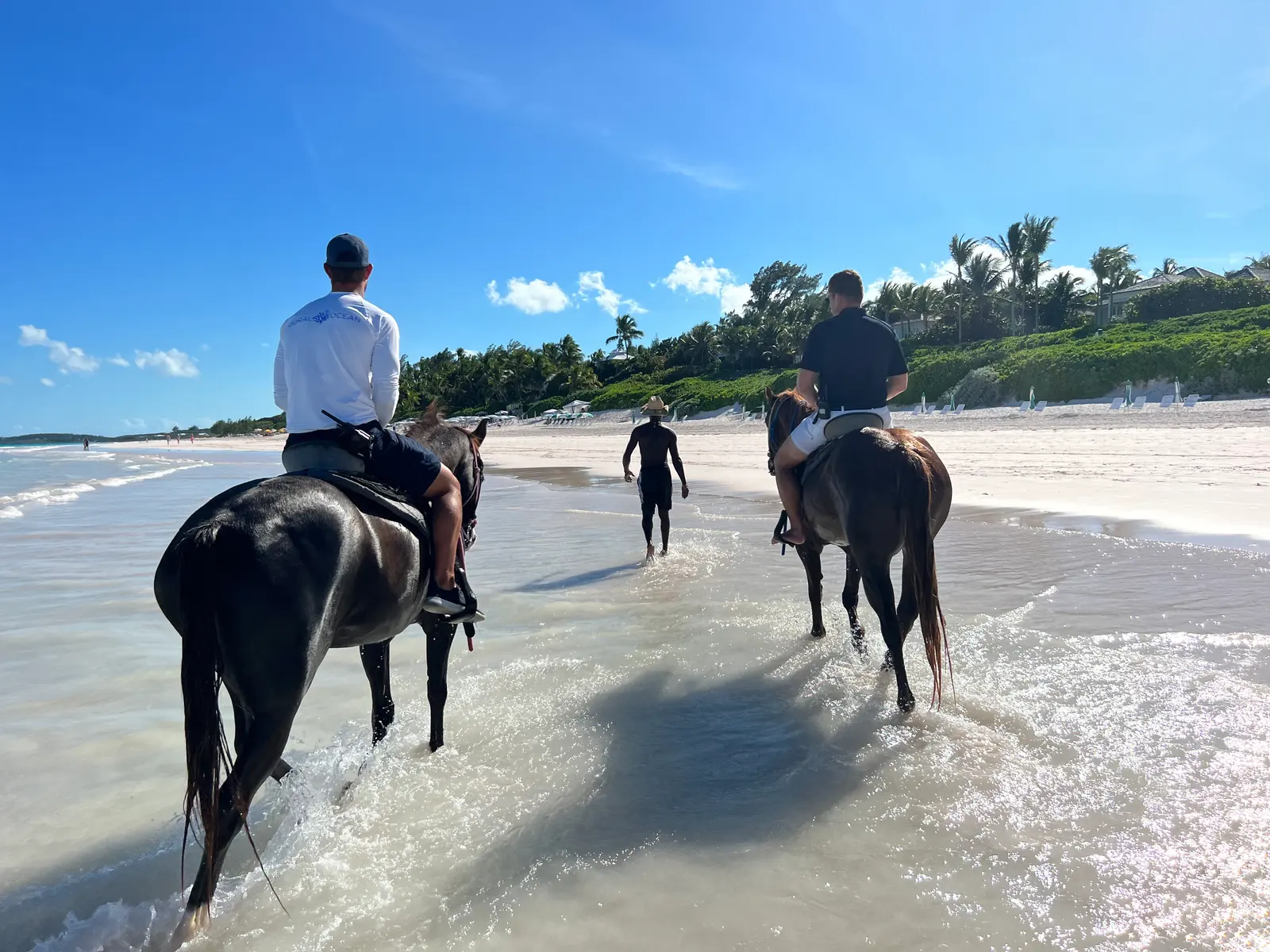 Riding out along the surf line on Pink Sands Beach