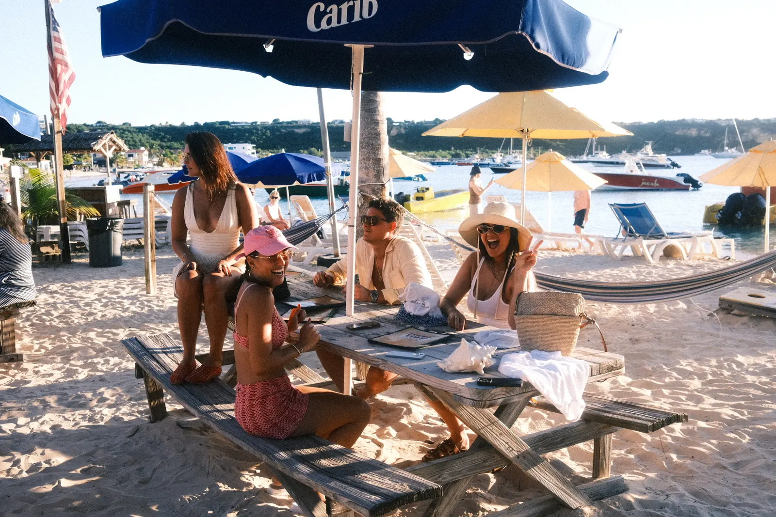The group at a table at Elvis' Beach Bar, Rendezvous Bay