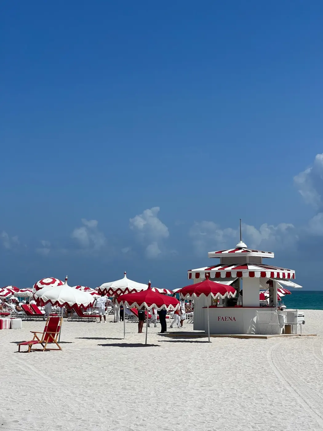 Red and white umbrellas and the Faena beach hut on Miami Beach